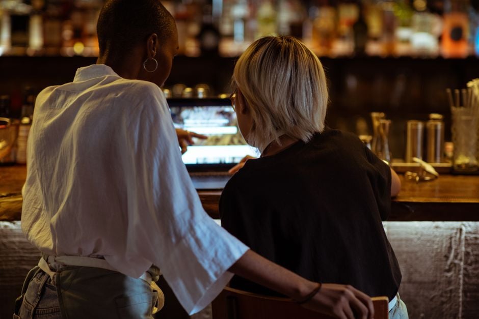 Two people looking at a laptop together