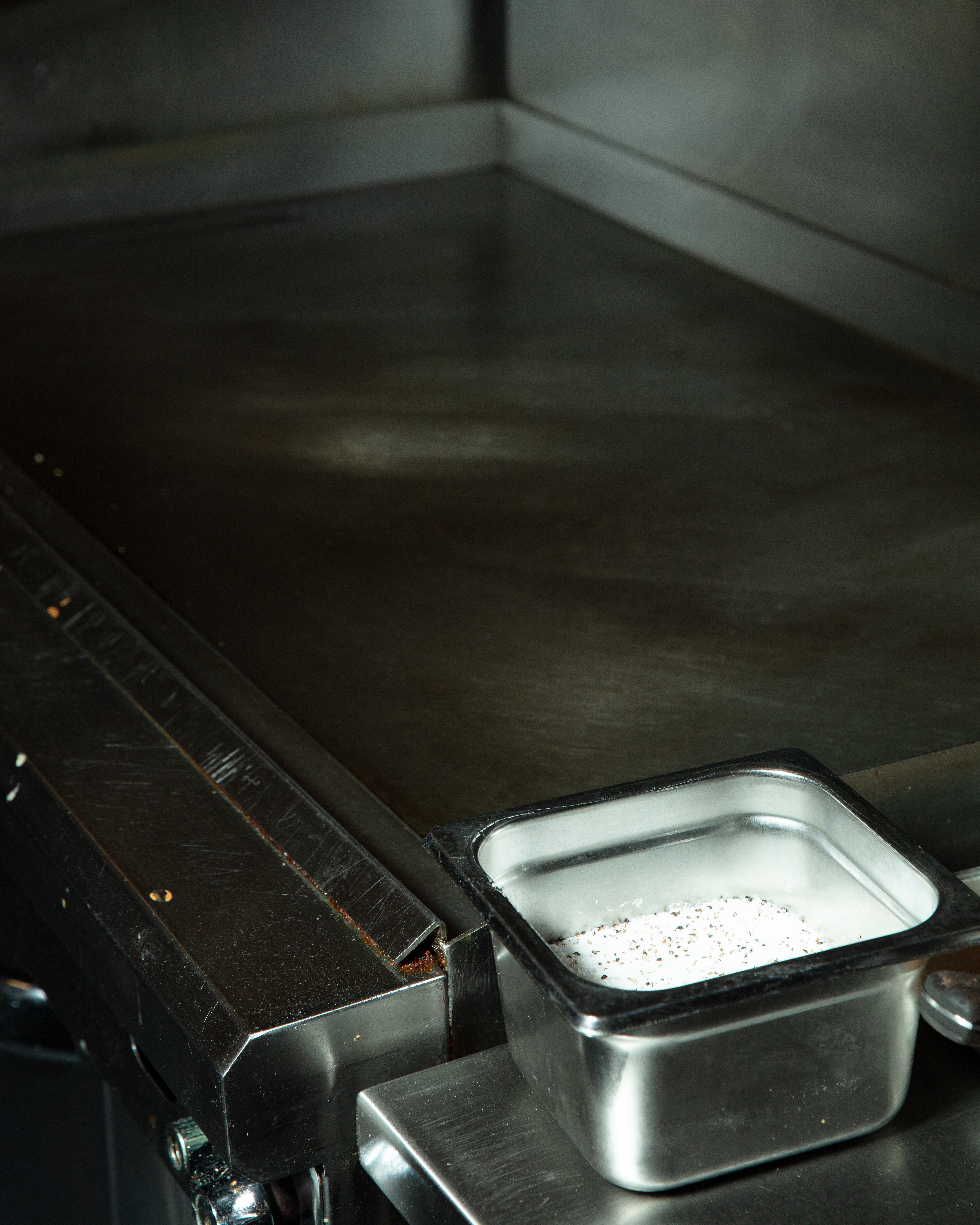 clean grill with salt bucket next to it